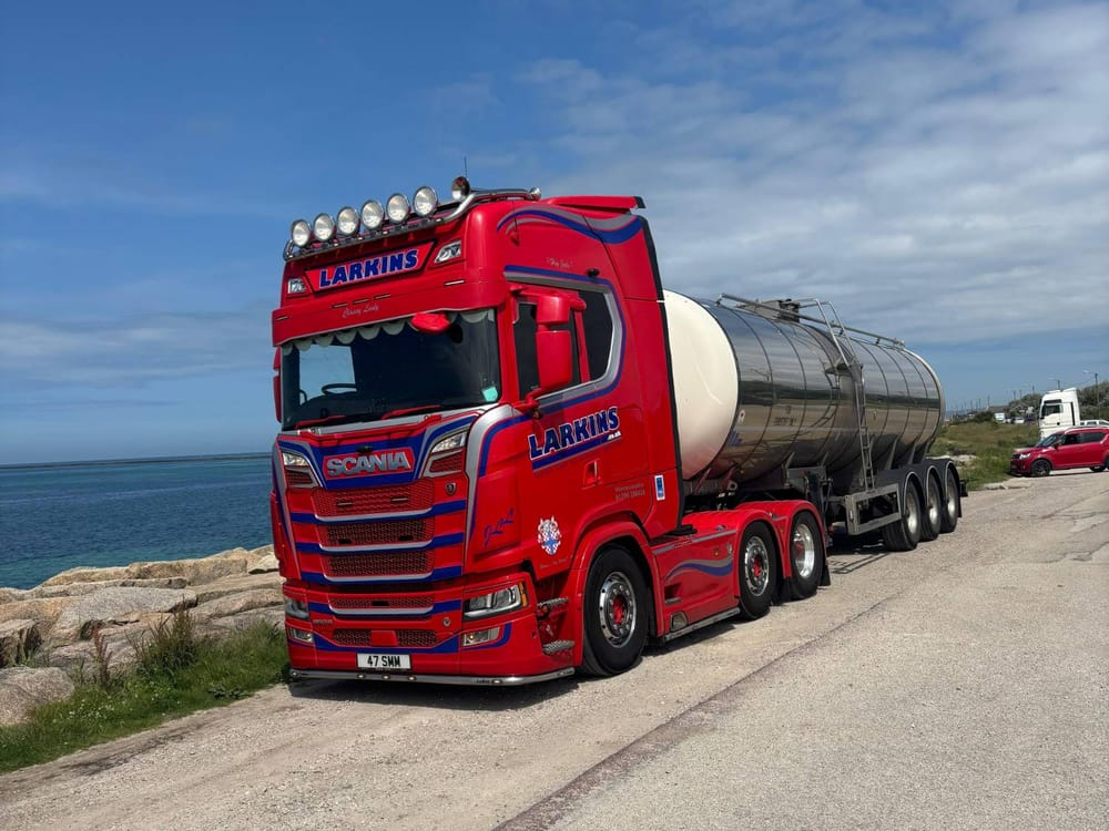 Larkins Scania 47 SMM coupled to a stainless bulk tanker, parked by the sea