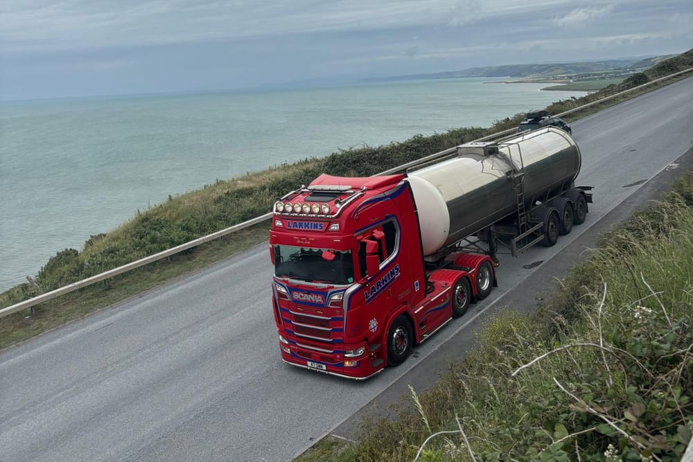 Larkins Scania tanker unit on a coast road, seen from above